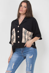 black oversized blouse with check pockets and gold buttons