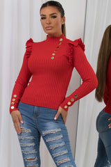 womens knitted jumper with gold buttons and frill shoulder