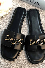 black slip on sliders with gold chain 