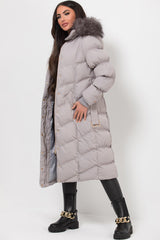 womens long puffer padded coat with fur hood and belt