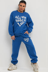 loungewear co ord set with all we need is love slogan