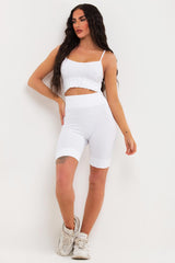 white cycling shorts and crop top gym wear set