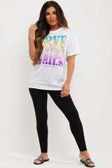 white oversized t shirt with love never fails print