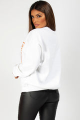 white sweatshirt with couture graphic slogan 